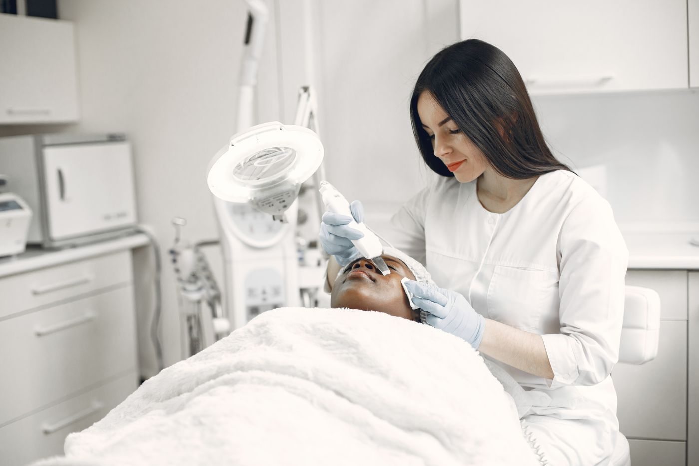 A physician assessing a patient at Skin&Co, Mississauga