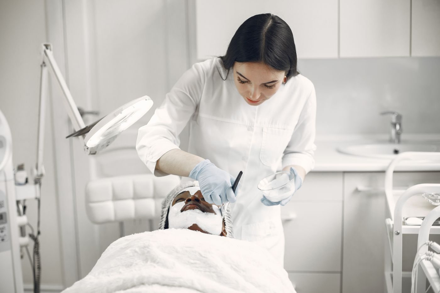 A physician assessing a patient at Skin&Co, Mississauga